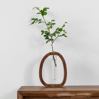 Compact oriental design walnut wood vase with dried pampas grass.