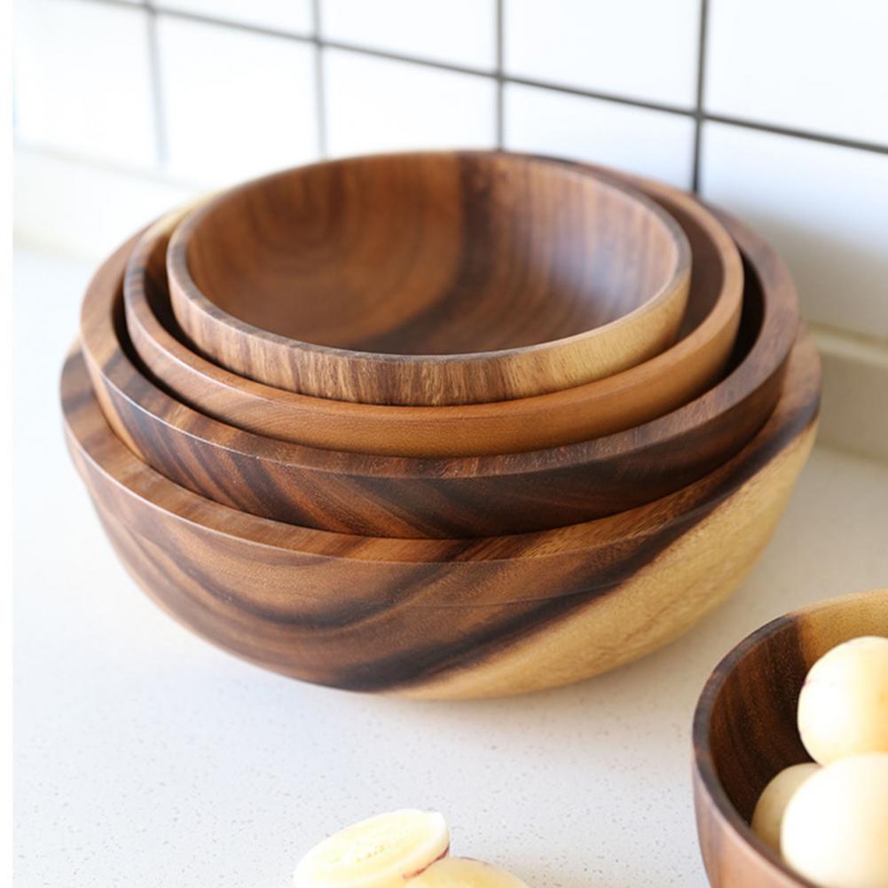 Close-up of the smooth heat-resistant finish on the wooden kitchen bowl.