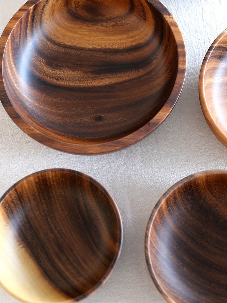 Eco-friendly premium natural wood bowl filled with fresh garden salad.