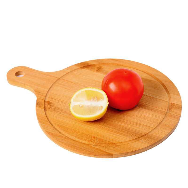 Lightweight bamboo pizza board displaying a fresh personal flatbread.