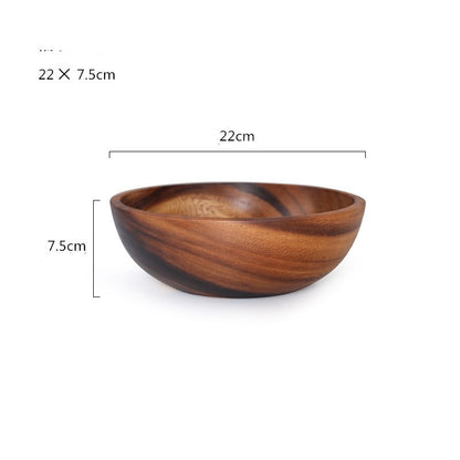 Decorative hand-painted wooden bowl used for family-style table dining.