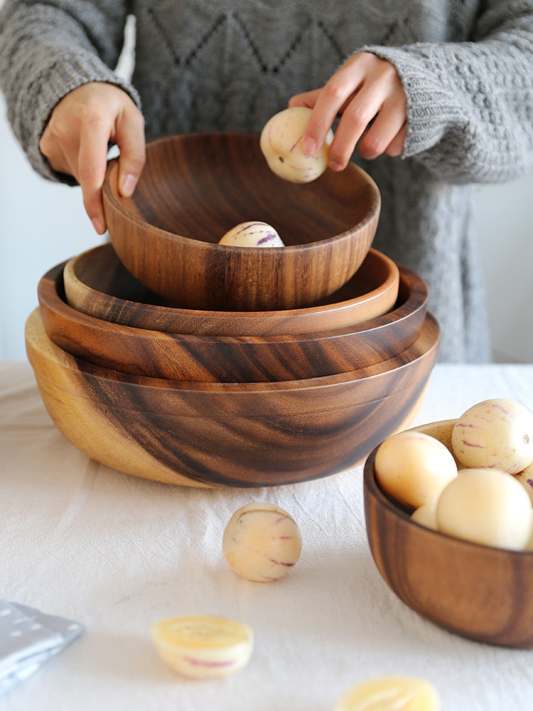 Japanese minimalist style wooden serving bowl on a dining table.