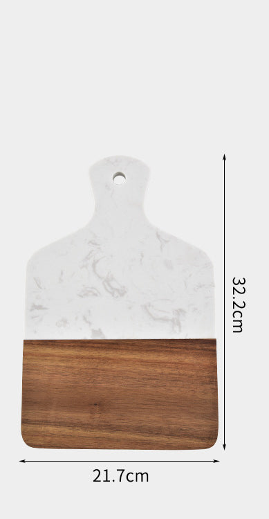 Close-up of the polished black marble and warm acacia wood combination.
