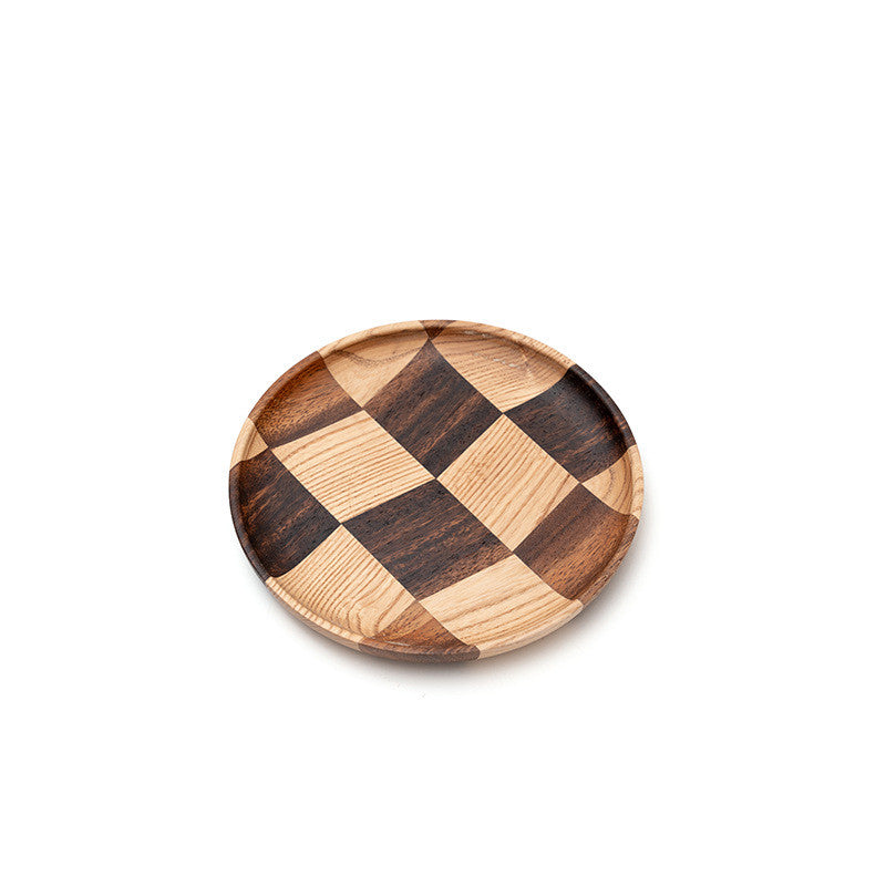 Close-up of the rich natural wood grain on the acacia serving plate.