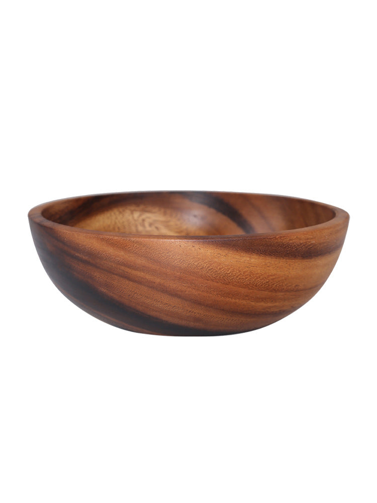 Eco-friendly premium natural wood bowl filled with fresh garden salad.