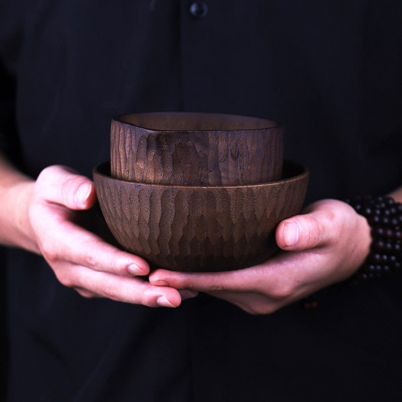 Round handmade wooden cheese bowl filled with diced cheese cubes.