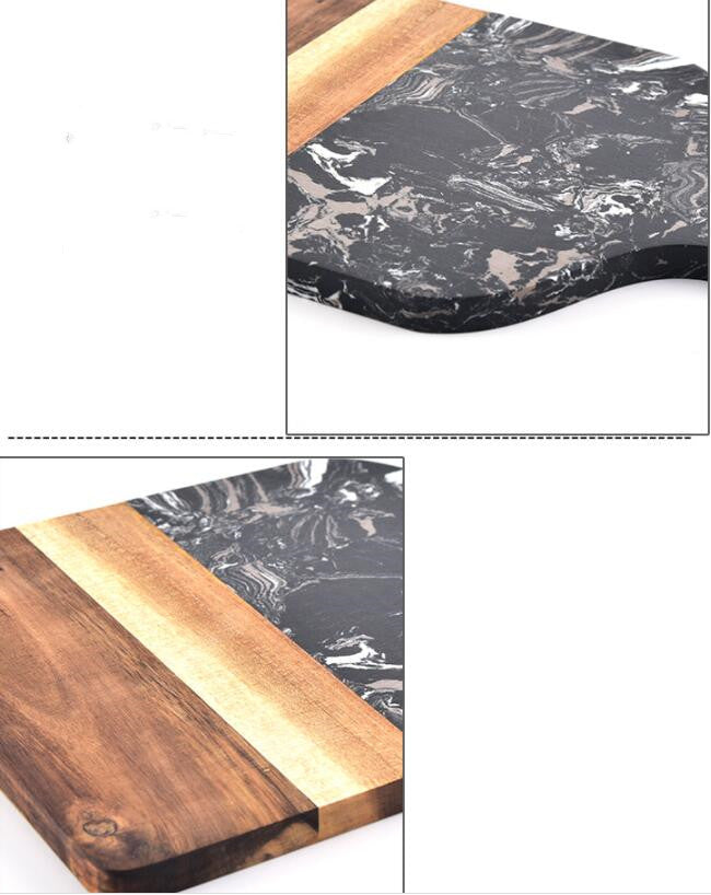 Close-up of the polished black marble and warm acacia wood combination.