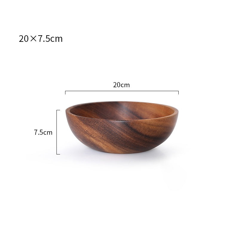 Close-up of the beautiful hand-painted details on the wooden kitchen bowl.