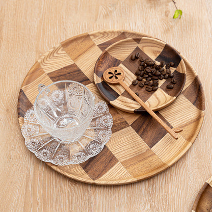 Close-up of the rich natural wood grain on the acacia serving plate.