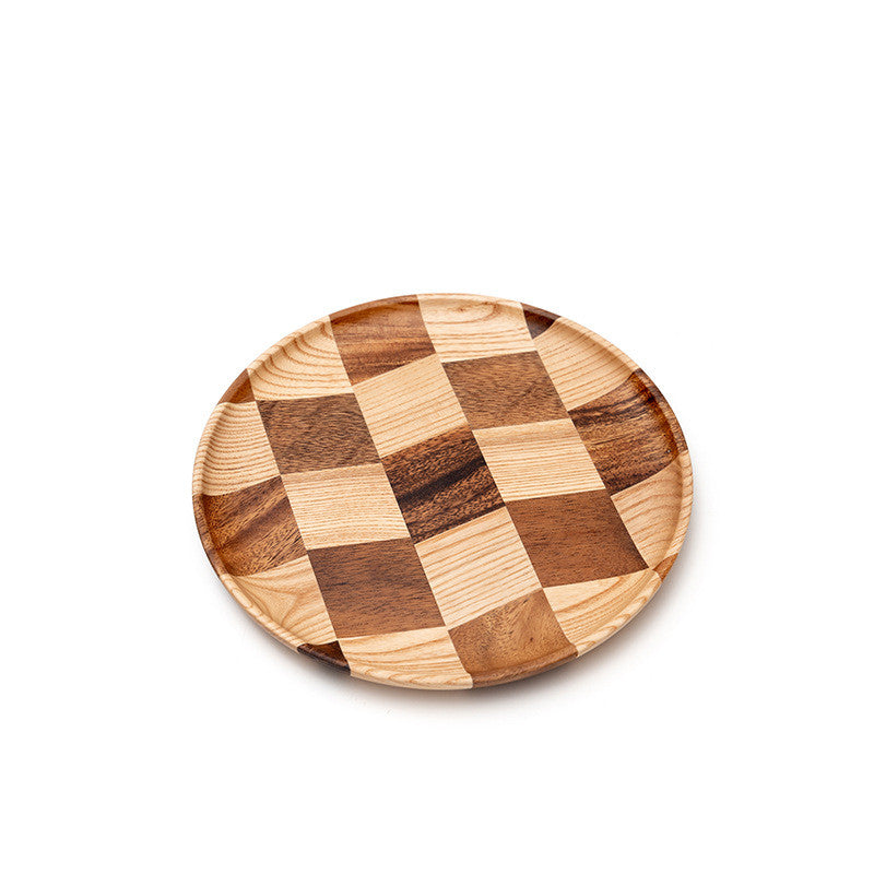 Acacia wood dessert and cheese board on a modern kitchen table.
