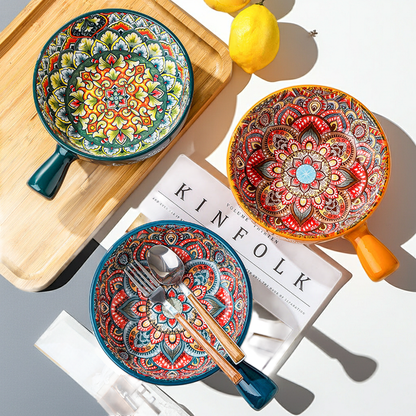 Close-up of the unique flower-shaped handle on the ceramic salad bowl.