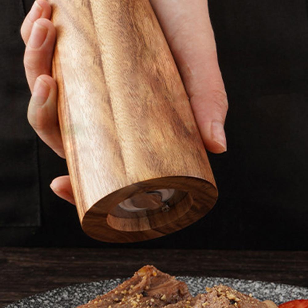Round head 8-inch manual acacia wood spice grinder for kitchen food prep.