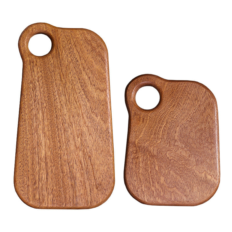 Premium dark ebony wood cutting board with an irregular organic shape.