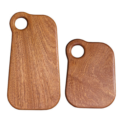 Premium dark ebony wood cutting board with an irregular organic shape.