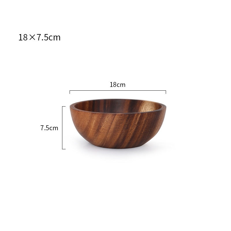 Close-up of the beautiful hand-painted details on the wooden kitchen bowl.