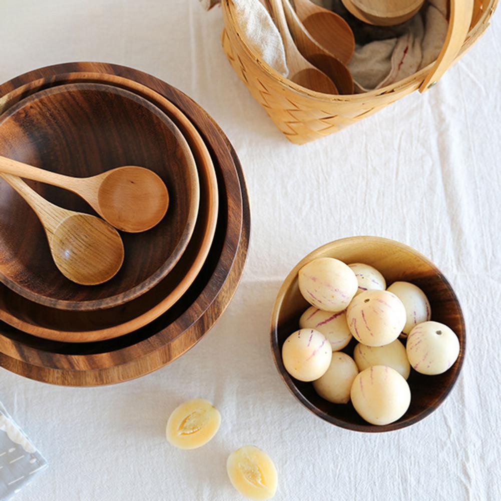 Close-up of the smooth heat-resistant finish on the wooden kitchen bowl.