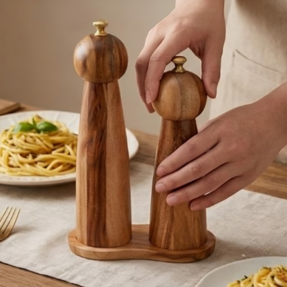 Rustic modern acacia wood manual grinder for fresh salt and peppercorns.